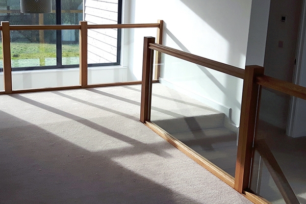 Landing with timber and glass balustrade for style and safety 